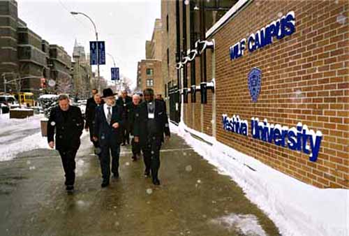 Catholic prelates guided by a rabbi outside the Yeshiva University in winter